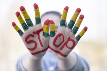 Gestures and the words stop, stop sign