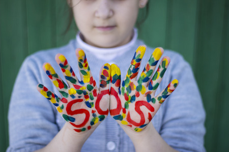 The inscription on the hands of SOS, help sign - SOS signの写真素材