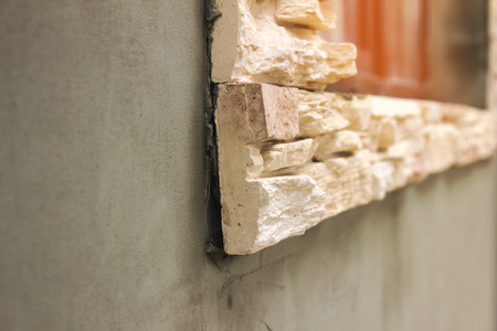 Facing masonry made of artificial stone walls of the houseの写真素材