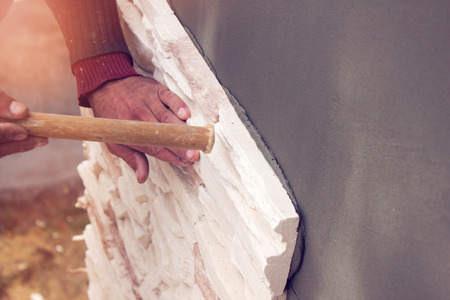 Facing the house artificial stone , construction worksの写真素材