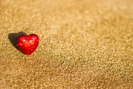 Red heart on a gold background, abstractの写真素材
