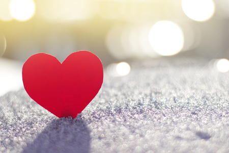 Red heart on the background of bright glowの写真素材