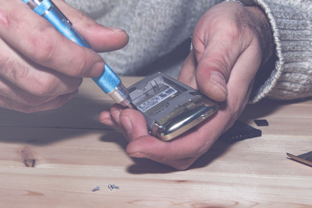 The cell phone repair closeup, top viewの写真素材