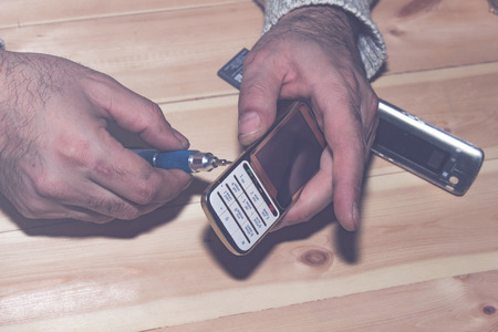 The cell phone repair closeup, top viewの写真素材