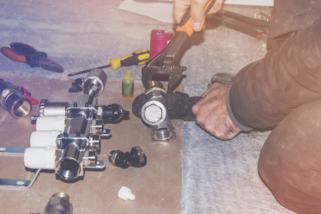 Assembling the heating system for the house, plumbing works