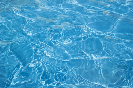 Surface of swimming pool water background