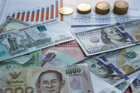 Money from different countries and financial graph on the tableの写真素材