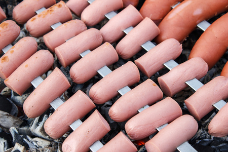 Roasting sausages on the fire, close-up viewの写真素材