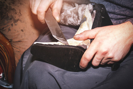 Man workshop making shoes