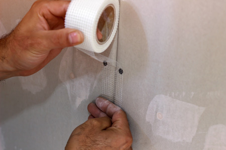 Man building or repairing houseの写真素材