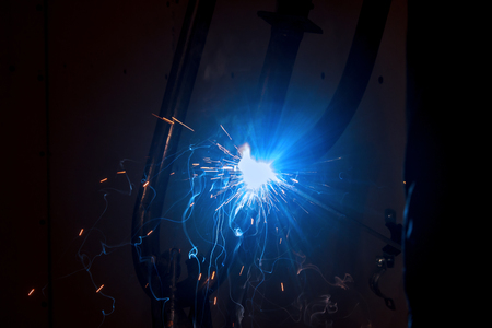 Worker at the factory weldingの写真素材