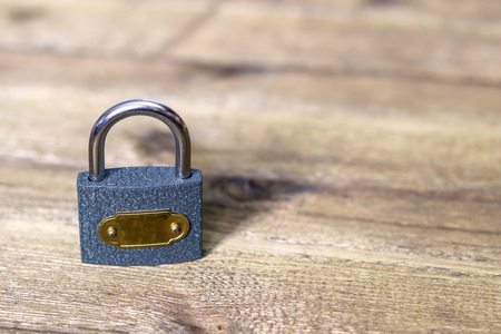Padlock on wooden table