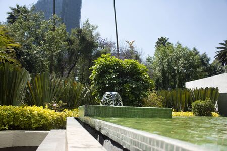 Mexico City and Gardens with a water source that feeds while the sun's rays illuminate the water...