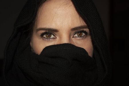 Mexican woman in black turban with big honey eyesの写真素材