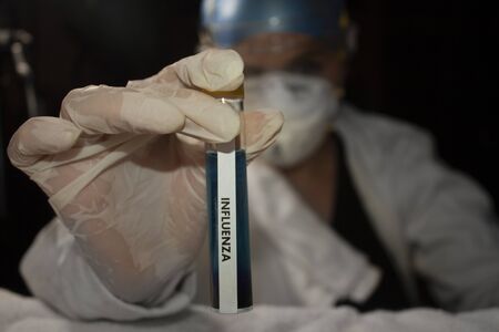 INFLUENZA H1 N1 vaccine in Mexico City passing through the hands of doctor of science for analysis of new knowledgeの写真素材