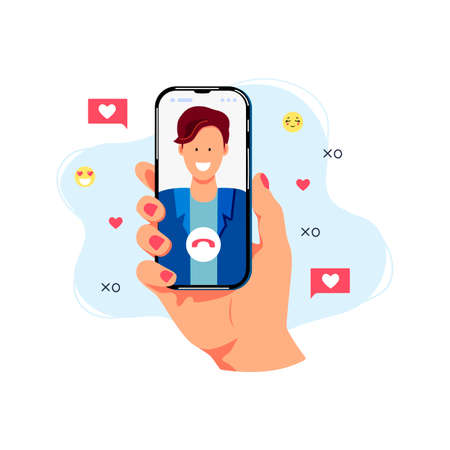 Hand is holding smartphone with smiling male person on screen. Video call concept. Flat cartoon style design. Vector illustration.のイラスト素材