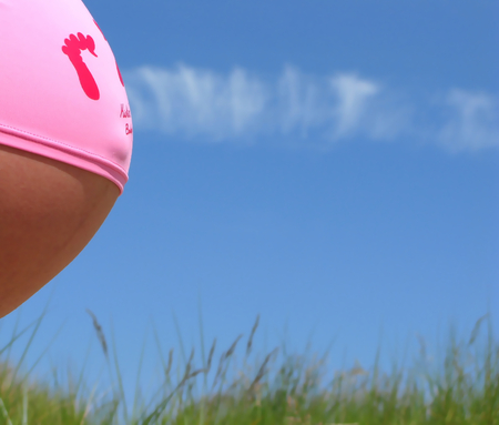 Mom with the baby enjoying the sunの写真素材