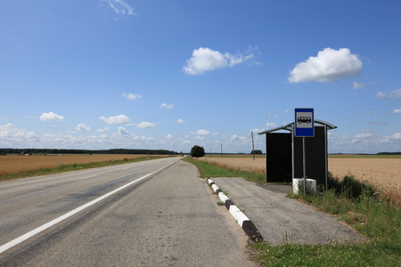 Lonely bus stop in the fieldsの写真素材