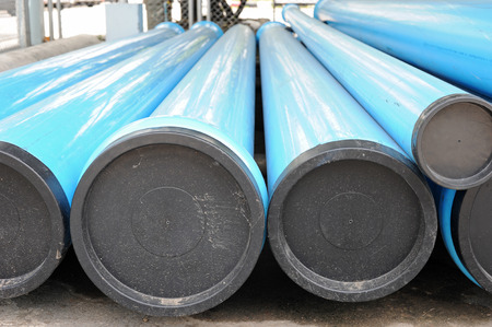 blue PVC water pipes with coversの写真素材