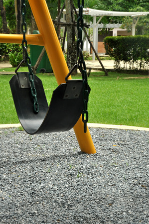 empty black leather swing in a play ground