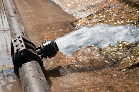 water gushing out of the pipeline during constructionの写真素材