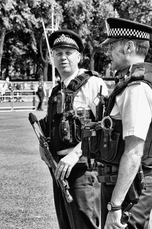 London, UK - JUL 5 : Guard Change Times at Buckingham Palace on Jul 5, 2011. The policeman maintain, protect, keep the peace when Guard Change Times at Buckingham Palaceのeditorial素材