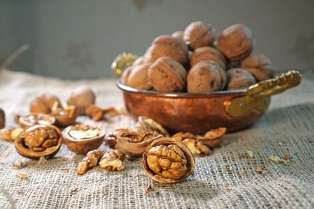 Walnuts. Composition with wallnuts on the sackcloth. Nuts on the table. の写真素材