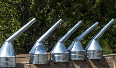 Variety of handmade tin funnels for sale 