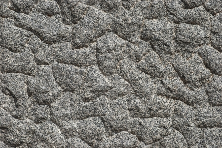 Granite block bumpy surface closeup as backgroundの写真素材