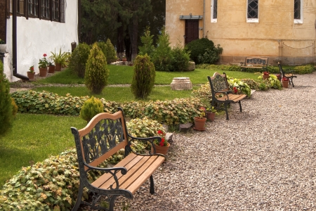 Alley with benches in orthodox monastery courtyardの写真素材