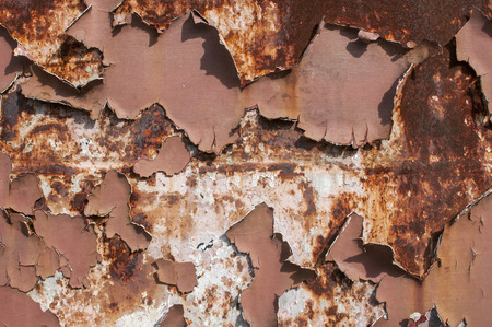 Metal weathered surface with old cracked paint layer as background