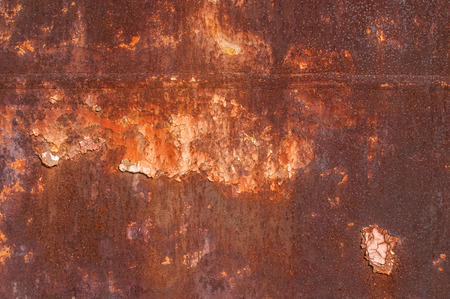 Metal weathered surface with old cracked paint layer as background