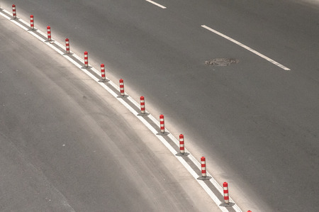 Part of used asphalt roadway with road marking linesの写真素材