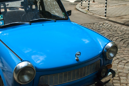 Blue vintage restored Trabant car on paved streetのeditorial素材