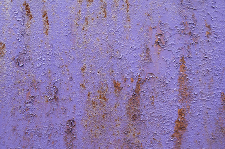 Violet purple painted grunge weathered rusty metal surface as backgroundの写真素材