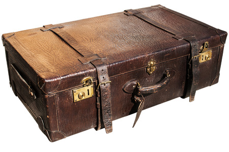 Old closed locked retro vintage leather suitcase closeup isolated on white backgroundの写真素材