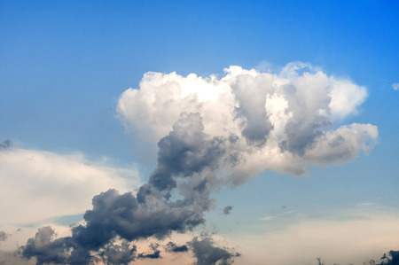 Strangely shaped cloud on blue sky backgroundの写真素材