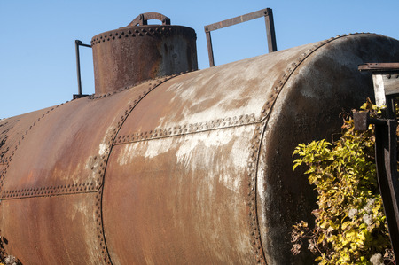 Old vintage weathered grunge abandoned train fuel and oil railway tankの写真素材