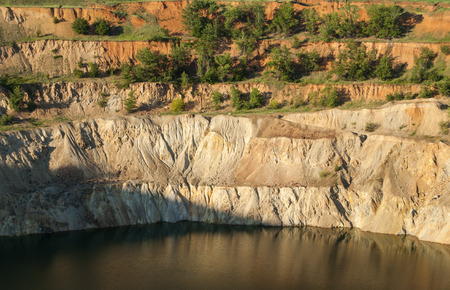 Trench filled with water at bottom of abandoned copper mine