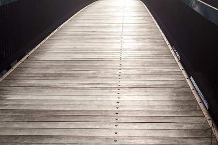 Surface of wooden boards with metal bolts in perspective as backgroundの写真素材