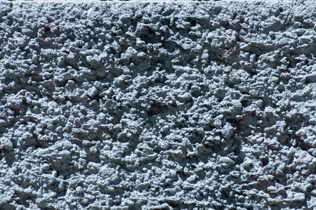Blue painted plastered house wall facade surface closeup as backgroundの写真素材