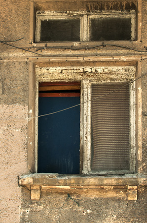 Grunge neglected window of old abandoned house closeupの写真素材