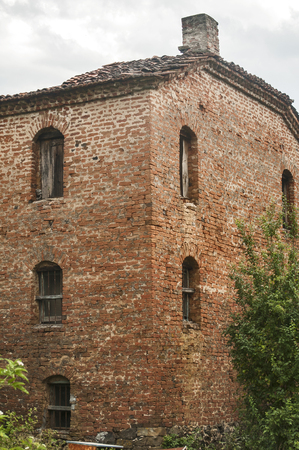 Old abandoned weathered retro vintage rural brick wall houseの写真素材
