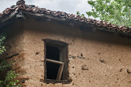 Old abandoned weathered retro vintage rural brick wall houseの写真素材