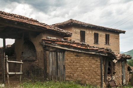Old abandoned weathered retro vintage rural brick wall houseの写真素材