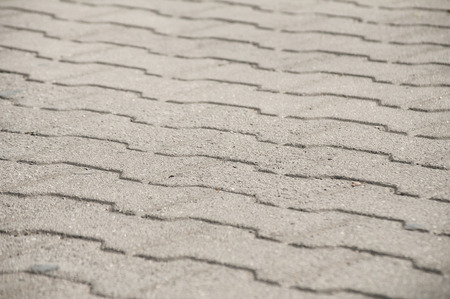 Street pavement cement slabs surface closeup as backgroundの写真素材
