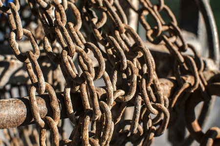Old rusty weathered grunge iron chains closeupの写真素材