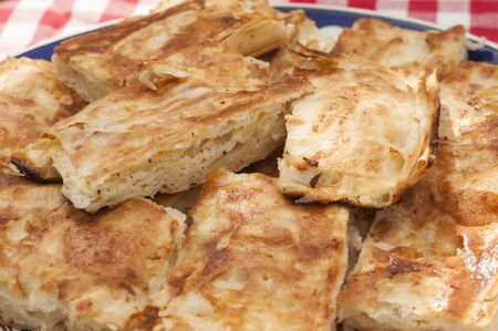 Pieces of traditional homemade filo pastry filled with white cheeseの写真素材