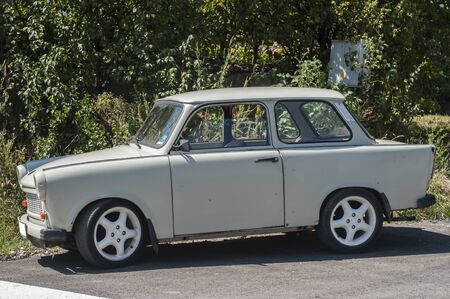 Vintage Trabant car side view closeup in sunny dayの写真素材