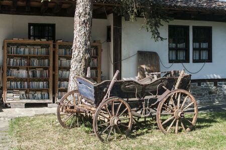 Old wooden rural carriage at old village country houseの写真素材